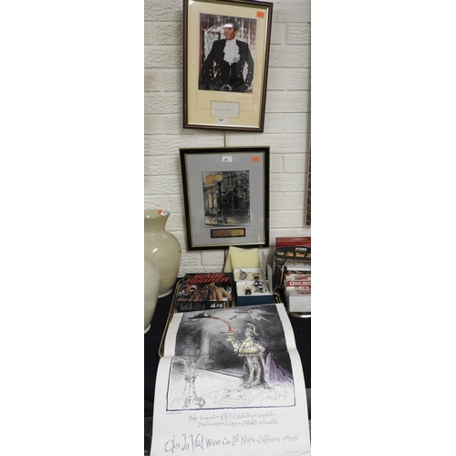 26 - Framed Gene Kelly 'Singing in the Rain' print, bearing a signature; also a George Lazenby photograph... 