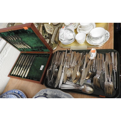 52 - Mother-of-pearl handled silver plated knives and forks; also plain silver plated cutlery wares