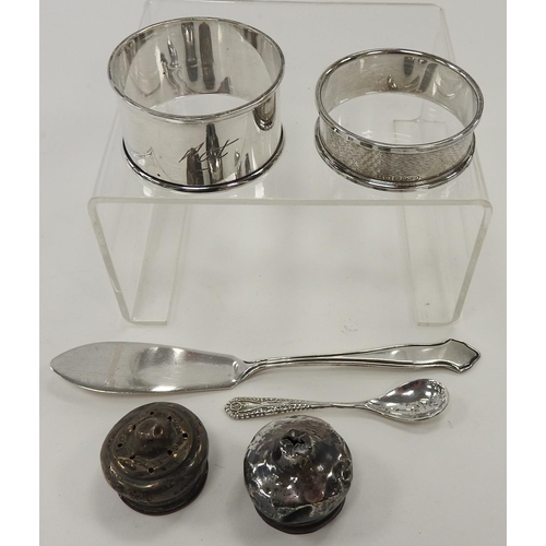 239 - Two silver napkin rings, silver butter knife, silver mustard spoon and two silver condiment caps