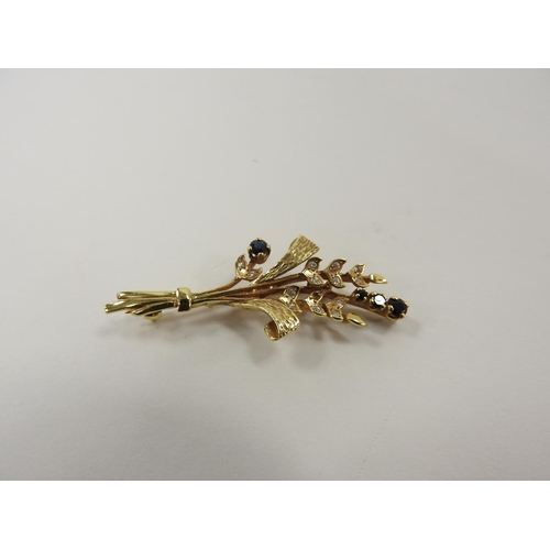 265 - 9ct gold sapphire and white stone floral spray brooch (one stone deficient), 50mm, gross weight appr... 