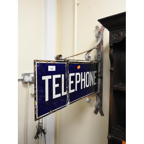 333 - Telephone enamelled wall sign with wrought iron brackets, width 57.5cm, height 72cm