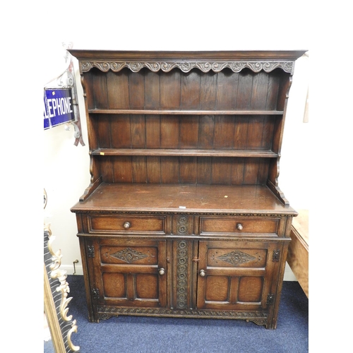 337 - Reproduction carved oak dresser and plate rack in the 17th Century style, width 140cm, height 182cm