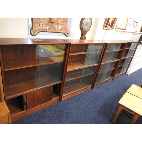 373 - Four 1960s glazed sliding door bookcases, supplied by Hammonds, each 91cm, height 111cm