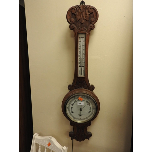 391 - Victorian carved oak aneroid barometer, the dial signed Gamage Limited, London