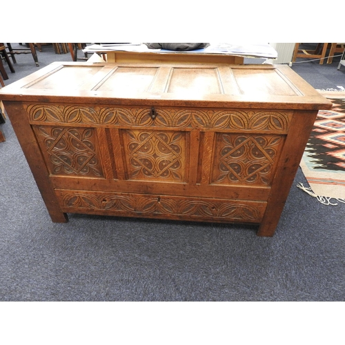 421 - Oak joined mule chest with carved decoration, width 121cm, height 70cm