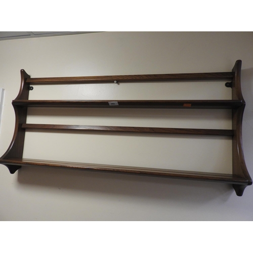 462 - Ercol elm wall plate rack, width 97cm