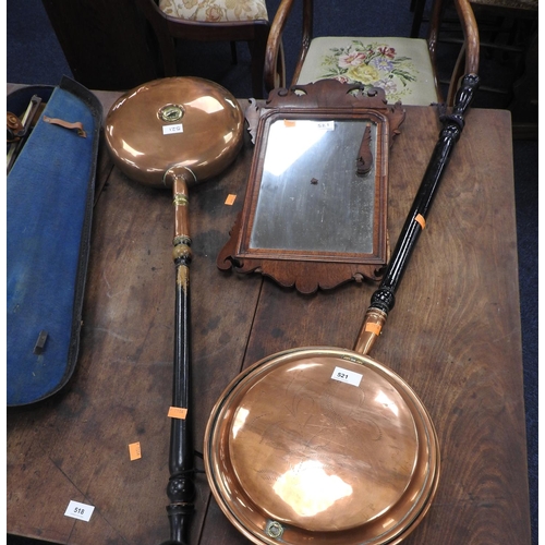 521 - Two copper warming pans and a walnut fretwork wall mirror (3)