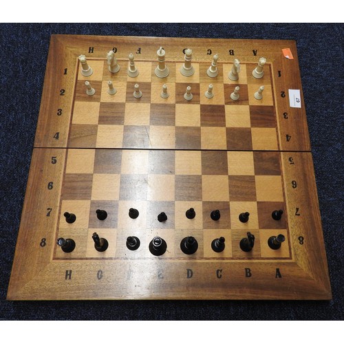 67 - Cased wooden chess board and backgammon box containing chess pieces