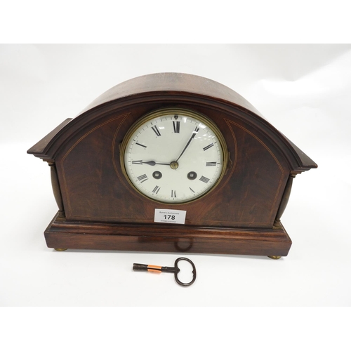 178 - Mahogany and inlaid chiming mantel clock with French movement, with key and pendulum, 31cm diameter