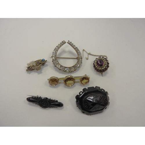 269 - Two Victorian jet brooches and four further decorative brooches (6)