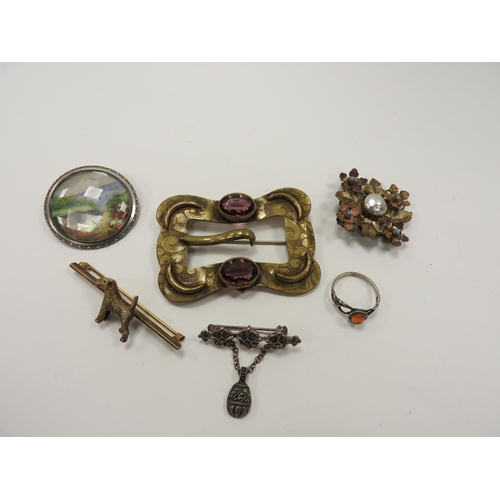 273 - Silver gilt terrier bar brooch and other costume jewellery including a brass belt buckle, three deco... 