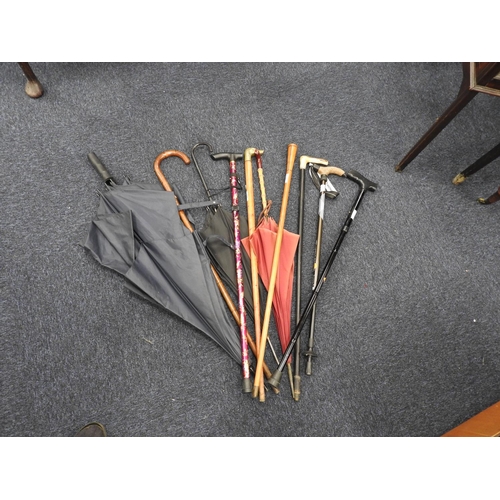 468 - Small assortment of walking canes and brollies