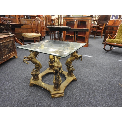 534 - Decorative plate glass topped table with rearing horse supports, 60cm square