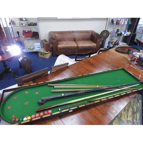 536 - Victorian mahogany folding bagatelle board with some cues; also Burnley Exhibition Billiard cue with... 