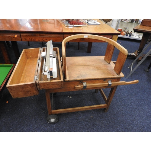 541 - Avery oak jockey scales to weigh 20st on a trolley base, width 72cm, height 82cm