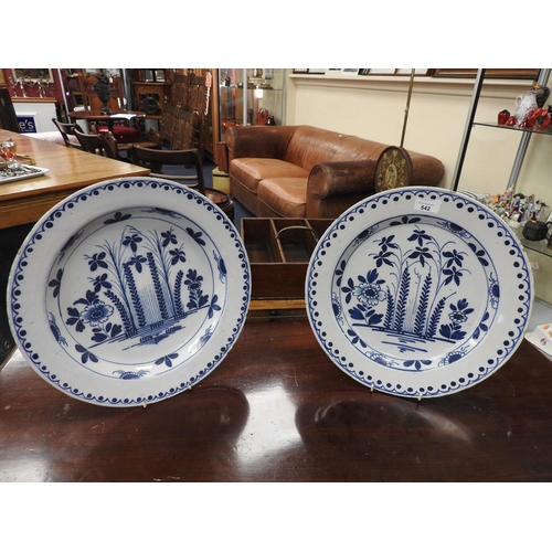 542 - Pair of delft blue and white plates, circa 1740-80, decorated with a formal design of flowers and re... 