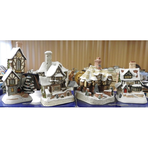 105 - Four David Winter winter edition cottages including 'Christmas Time Clockhouse', with boxes