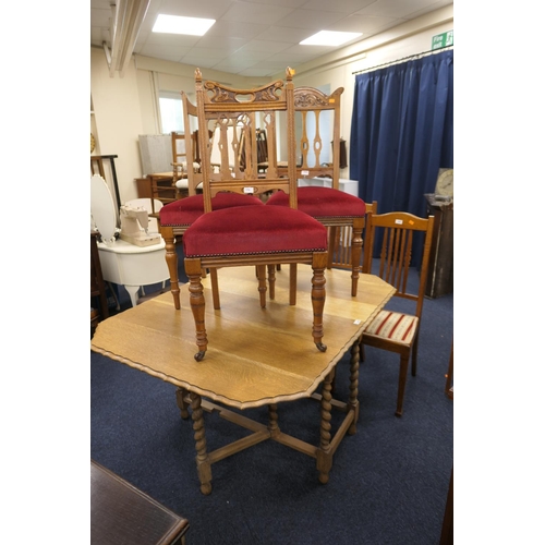 440 - Light oak barley twist drop leaf table together with three red fabric upholstered oak dining chairs ... 