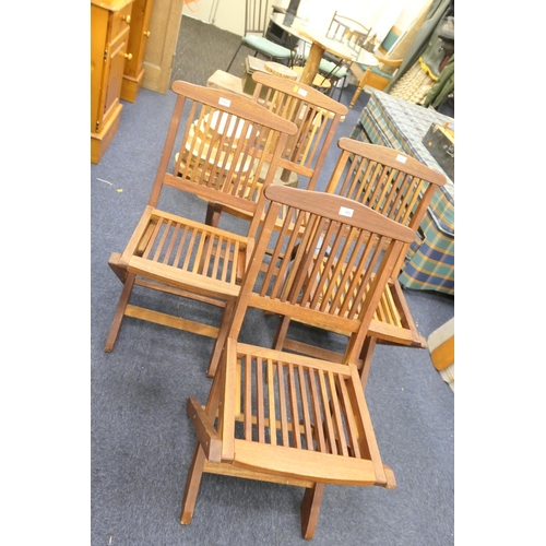 460 - Four teak folding garden chairs