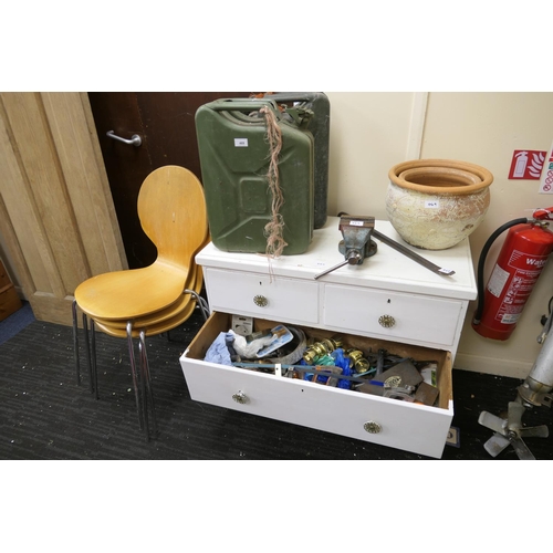 469 - Two jerry cans, white painted chest of drawers with tool contents, bench vice, stacking plywood chai... 