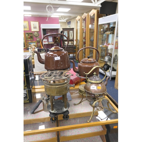 508 - Two brown enamelled kettles, the Beatrice paraffin greenhouse heater, other burners, blow torch and ... 