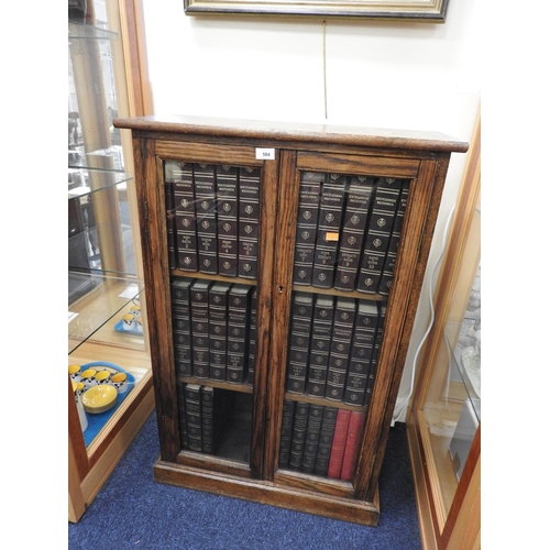 584 - Oak glazed bookcase containing 25 volumes of Encyclopaedia Britannica; also other Britannica related... 