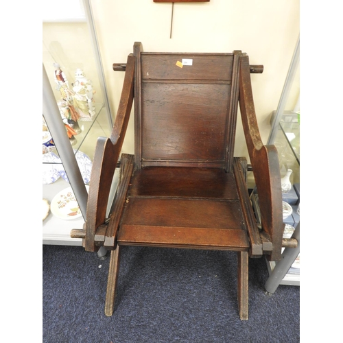 596 - Glastonbury type oak armchair