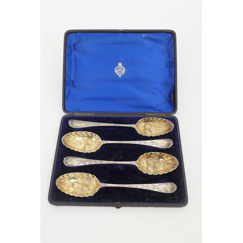 137 - Cased set of four George III silver gilt 'berry' spoons, London 1771, later decoration, weight appro... 