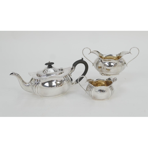 147 - Edwardian silver three piece tea service, Sheffield 1905, comprising an ogee bombe form teapot with ... 