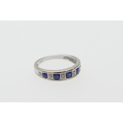 395 - Synthetic sapphire and diamond half eternity ring, in 9ct white gold, the round cut stones channel s... 