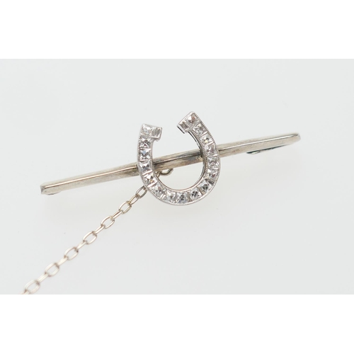 432 - Diamond horse shoe bar brooch, in 9ct white gold, set with sixteen square cut diamonds, well matched... 