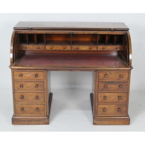 641 - Victorian mahogany cylinder front desk, circa 1870, barrel front lifting to reveal four small drawer... 