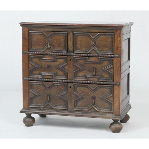 654 - Oak moulded chest of drawers, in the Jacobean style, fitted with two short and two long drawers with... 