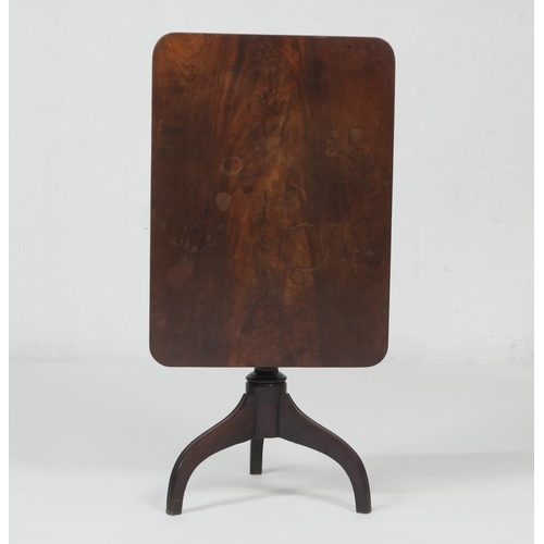 657 - Mahogany tilt top tripod table, the rectangular top over a turned baluster column and three umbrella... 