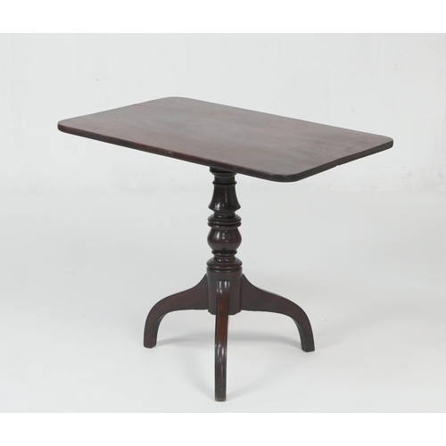 657 - Mahogany tilt top tripod table, the rectangular top over a turned baluster column and three umbrella... 