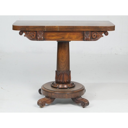 672 - William IV rosewood folding pedestal card table, circa 1835, the top swivelling over an acanthus car... 