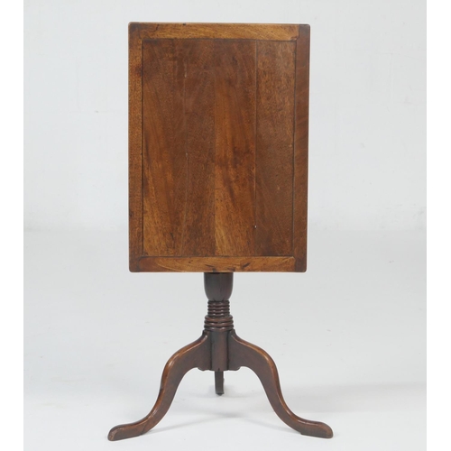 695 - Provincial fruitwood tilt top tripod table, the rectangular top tilting over a turned urn column and... 