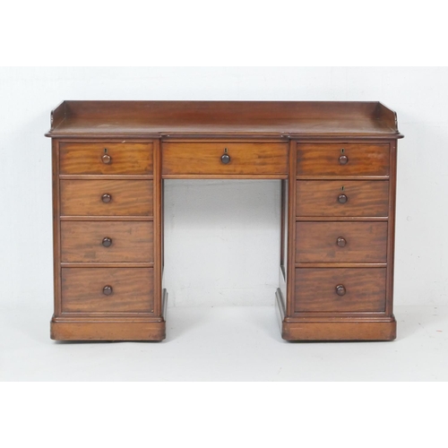 704 - Victorian mahogany kneehole washstand, circa 1860, three-quarter gallery, fitted with a configuratio... 