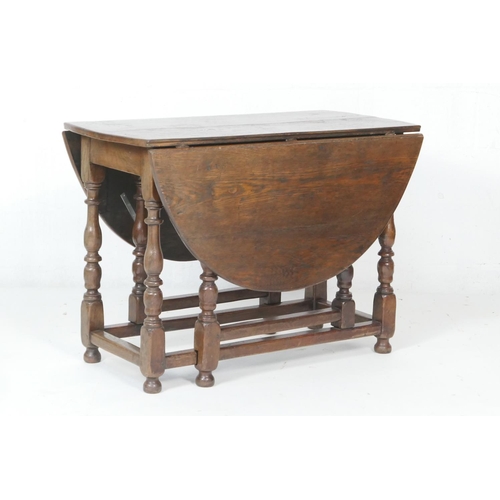 707 - Oak gateleg table, 18th Century with later alterations, oval top with drop leaves, supported on swin... 