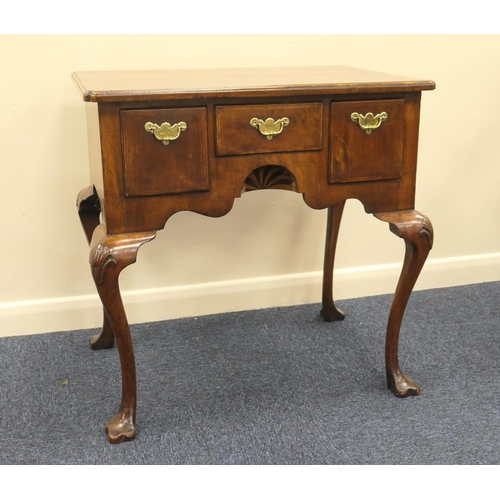 713 - Queen Anne style walnut lowboy, feather banded top with kick-in corners, over three drawers with cen... 