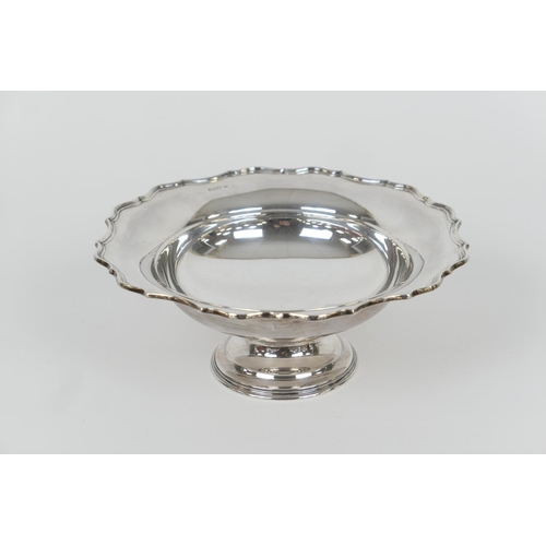 72 - George V silver footed fruit bowl, by Barker Bros., Chester 1919, shaped circular form over a steppe... 