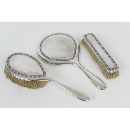 74 - Liberty & Co. silver and enamelled vanity set, Birmingham 1938, comprising hand mirror, hairbrush an... 