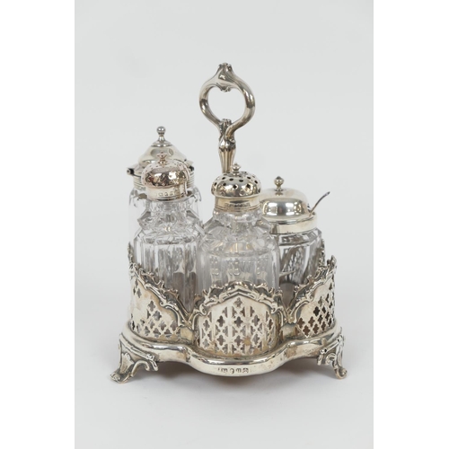 85 - Victorian silver cruet stand, Sheffield 1851, lobed basket form with wooden base and centred with a ... 