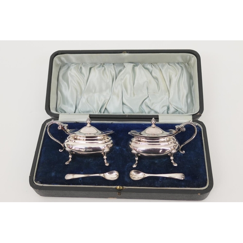 94 - George V cased silver wet mustard pots, maker HW, Sheffield 1912, each with clear glass liner and tw... 