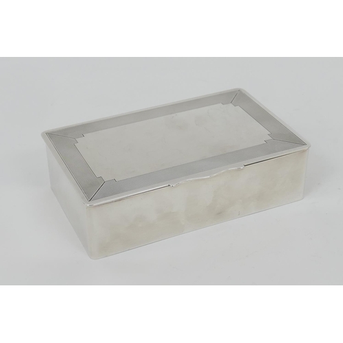 99 - Elizabeth II silver cigarette box, by Mappin & Webb, Birmingham 1990, hinged cover with engine turne... 