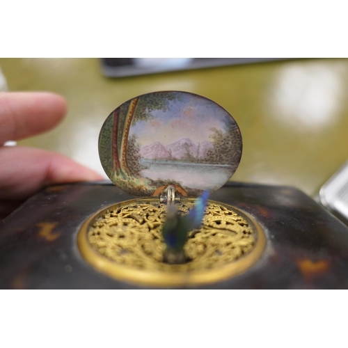 553 - Tortoiseshell singing bird automata music box, 19th Century, having a landscape enamelled cover open... 