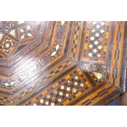 649 - Moorish octagonal parquetry table, circa 1900, inlaid throughout with mother of pearl and wood tesse... 