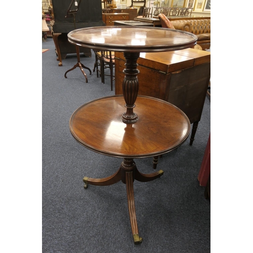 686 - George III mahogany dumb waiter, pedestal form with two circular moulded edge shelves, on a turned a... 