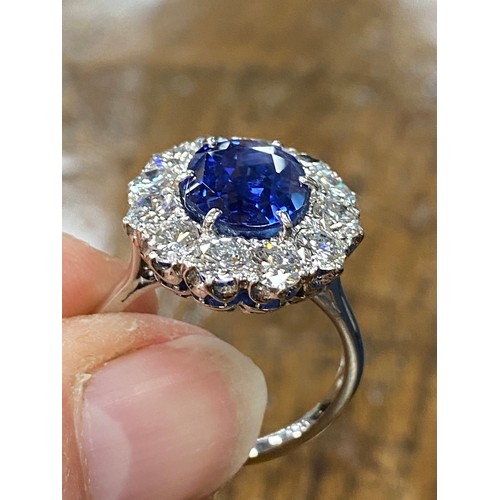 440 - Fine sapphire and diamond cluster ring by Boodles, the mixed cushion cut natural sapphire measuring ... 