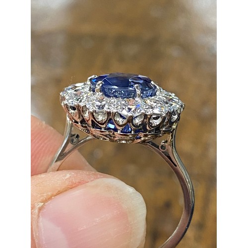 440 - Fine sapphire and diamond cluster ring by Boodles, the mixed cushion cut natural sapphire measuring ... 